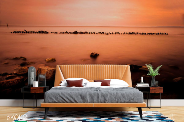 krajobraz falochron nad morzem w pomarańczowej poświacie - fototapeta