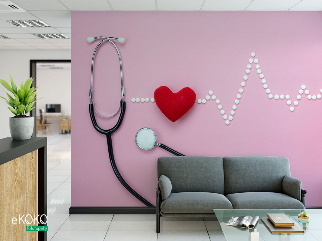 stetoskop z czerwonym sercem i tabletkami na różowym tle - fototapeta do gabinetu medycznego